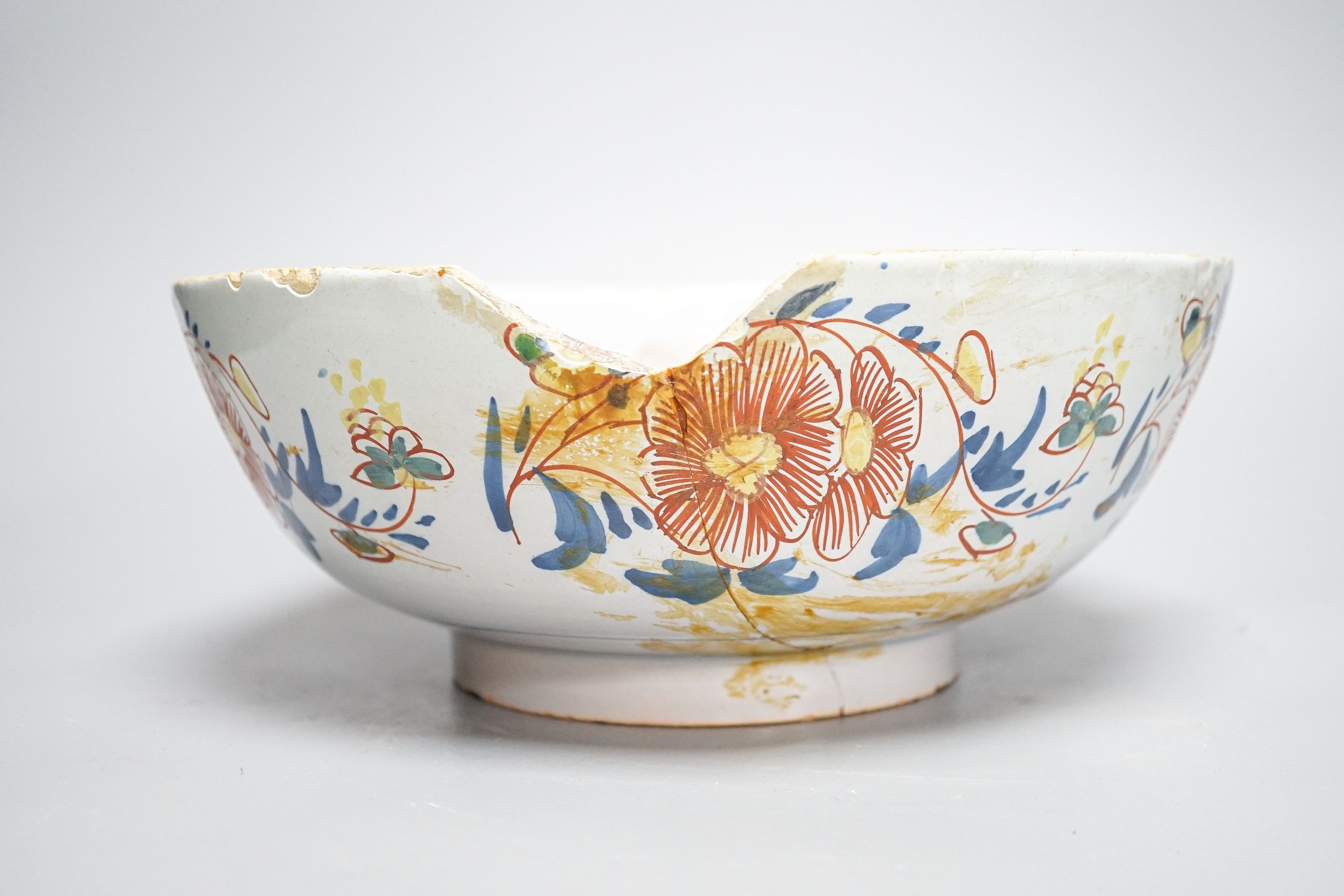 An 18th century English polychrome delftware bowl, interior inscribed 